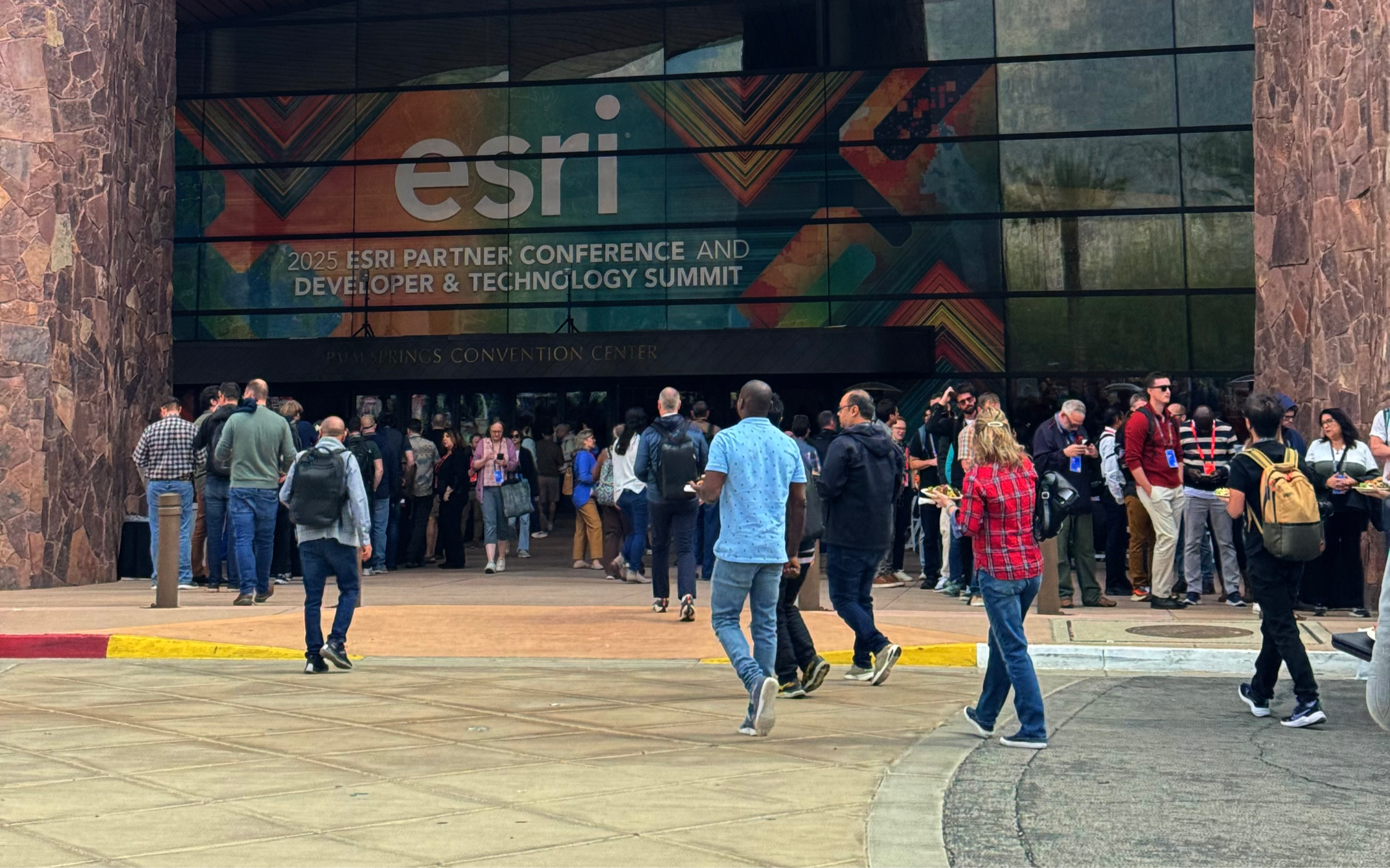 Attendees engaging at a live Esri conference event